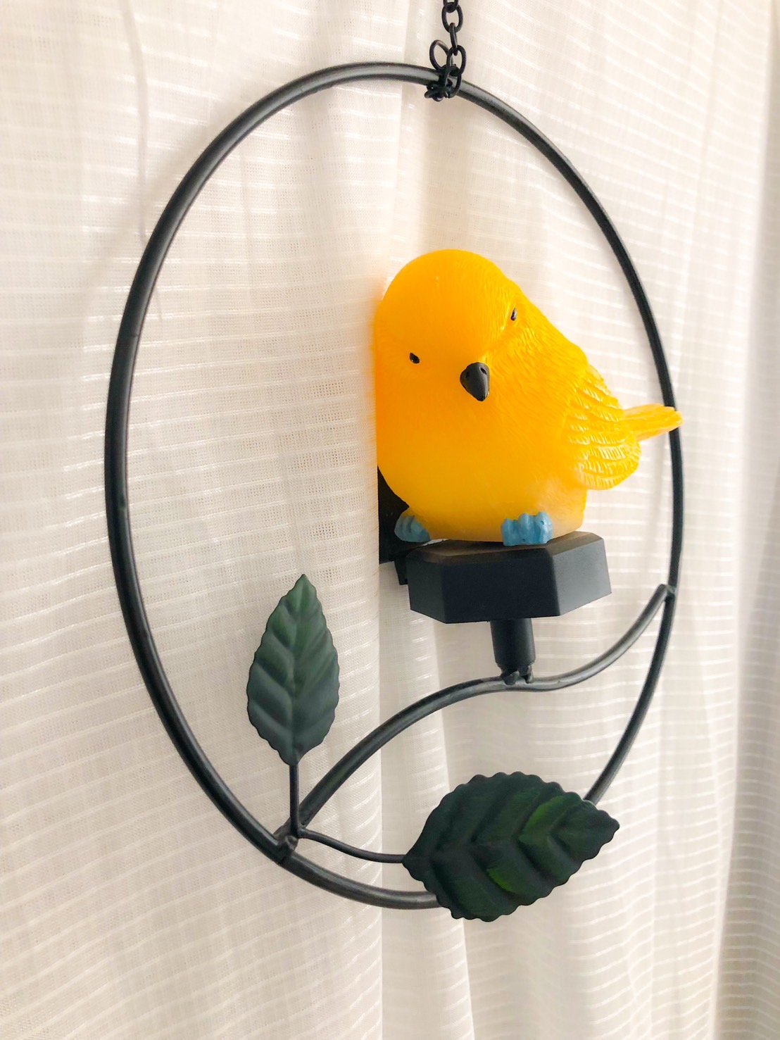 Yellow bird ornament on the wall